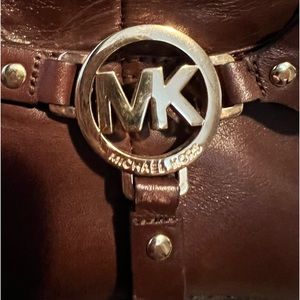 MK boots good lighty worn shape a little scuff on bottom back